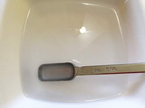 stirring the borax into the water so it dissolves